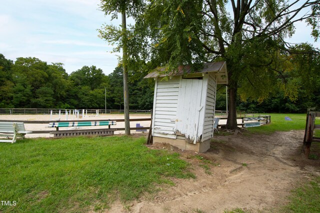 view of outdoor structure with a lawn