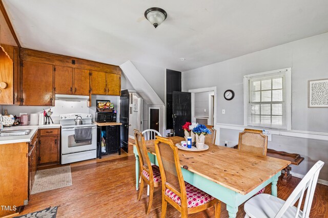 dining area with hardwood / wood-style floors