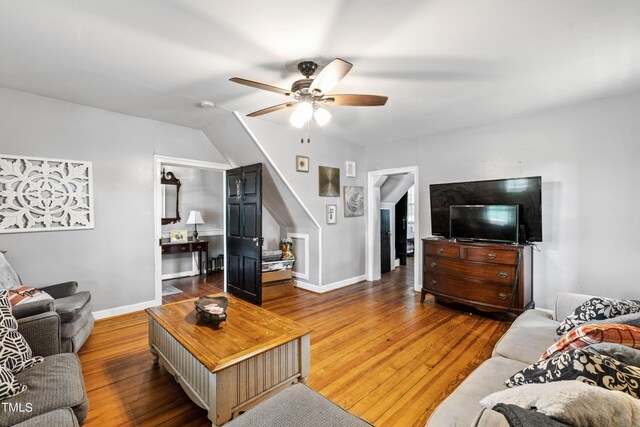 living room featuring ceiling fan and wood-type flooring