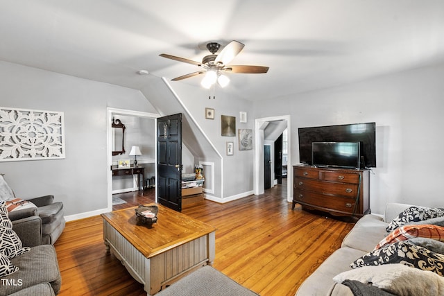 living area with ceiling fan, wood finished floors, and baseboards