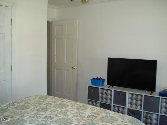 bedroom featuring ornamental molding