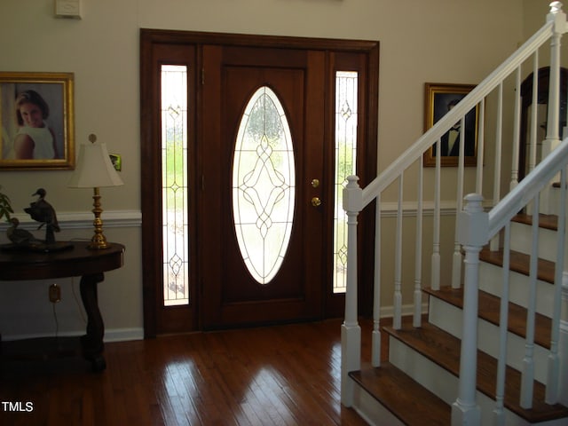 entrance foyer with dark hardwood / wood-style floors