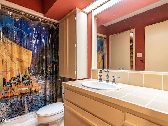 bathroom featuring walk in shower, toilet, and vanity