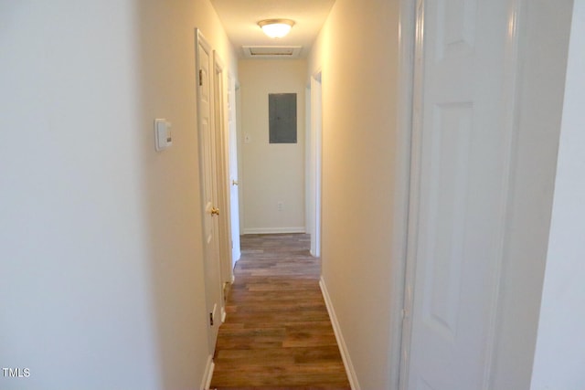 corridor featuring wood-type flooring and electric panel