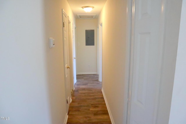 corridor with electric panel and dark hardwood / wood-style floors