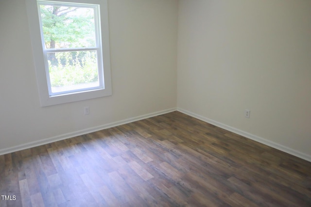 empty room featuring dark hardwood / wood-style floors