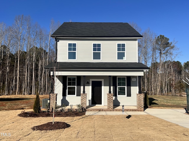 view of front of house featuring cooling unit and a porch