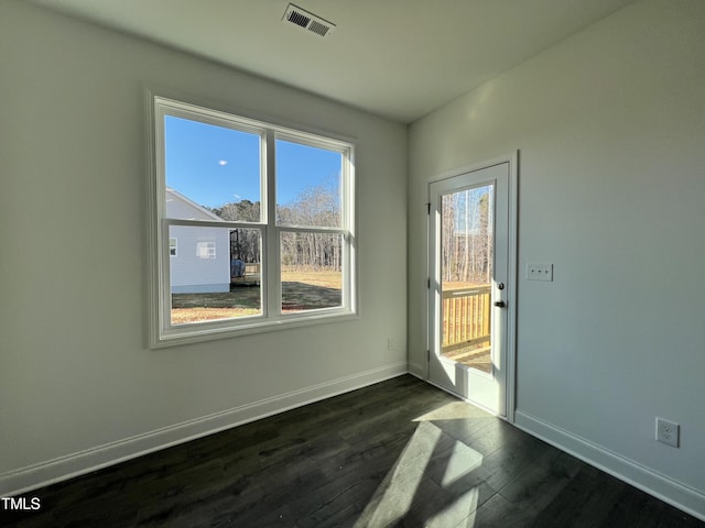 empty room with dark hardwood / wood-style floors