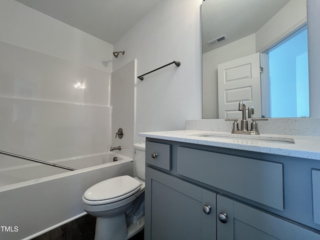 full bathroom with hardwood / wood-style flooring, vanity, bathtub / shower combination, and toilet