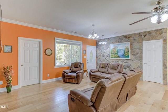 living area featuring visible vents, light wood-style floors, and ornamental molding