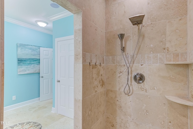 full bath featuring crown molding, baseboards, and a tile shower