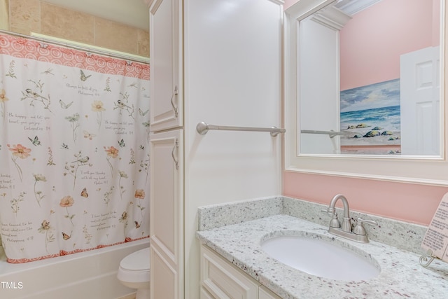 bathroom with shower / bath combo with shower curtain, toilet, and vanity