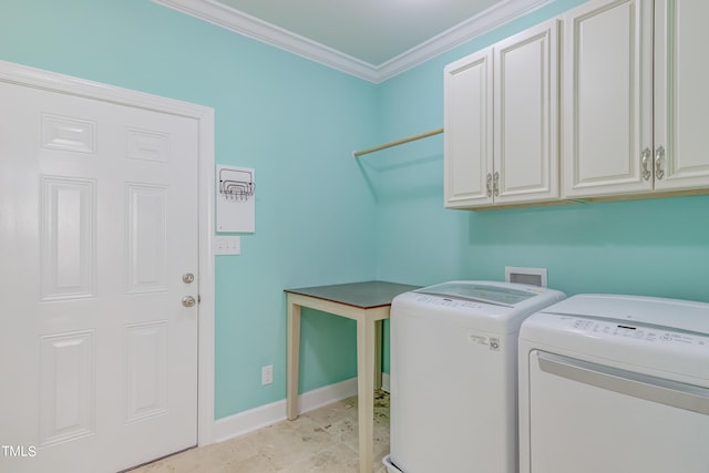 clothes washing area featuring ornamental molding, cabinet space, baseboards, and washer and clothes dryer