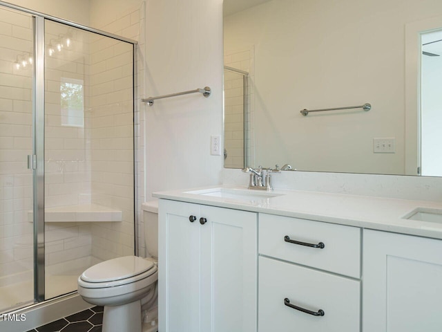 bathroom with vanity, an enclosed shower, toilet, and tile patterned floors