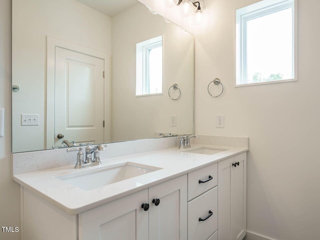 bathroom featuring double vanity