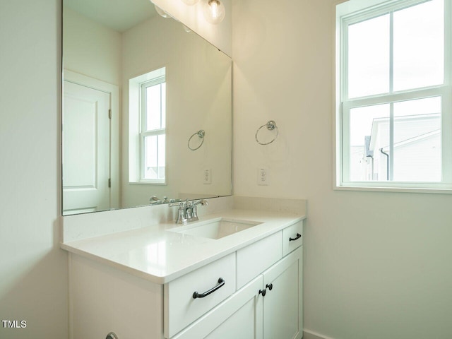 bathroom with vanity and plenty of natural light