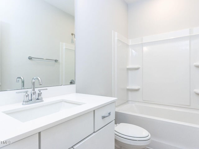 full bath with  shower combination, vanity, and toilet