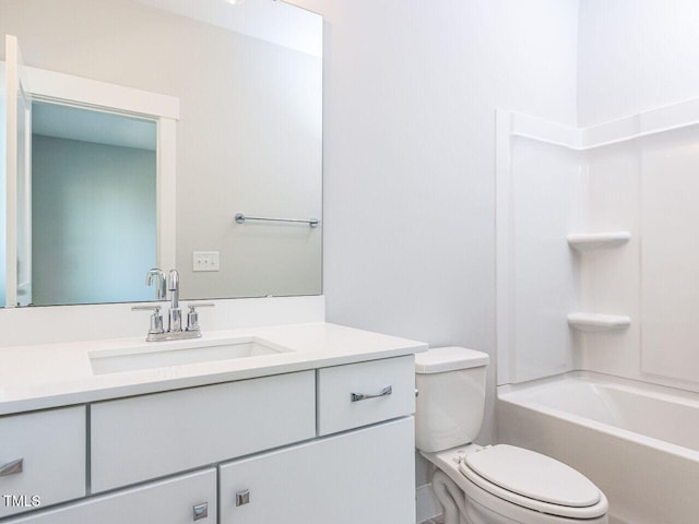 bathroom with bathing tub / shower combination, vanity, and toilet