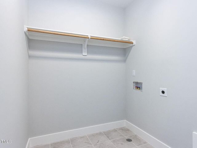 laundry room with laundry area, hookup for a washing machine, baseboards, and hookup for an electric dryer