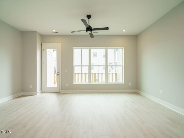 unfurnished room with ceiling fan, recessed lighting, wood finished floors, and baseboards