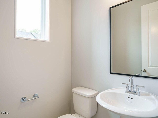 bathroom with a sink and toilet