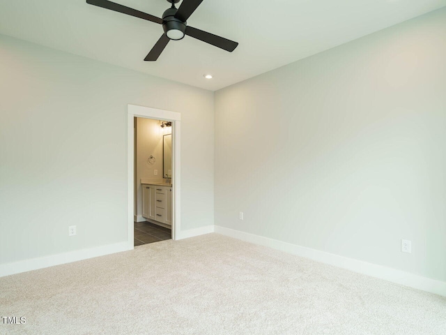 unfurnished bedroom with baseboards, ensuite bath, ceiling fan, carpet floors, and recessed lighting