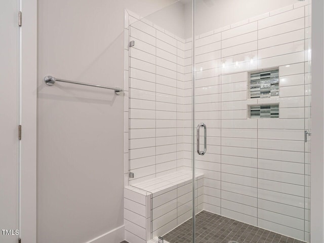 bathroom with a shower stall