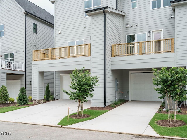 exterior space with an attached garage and concrete driveway