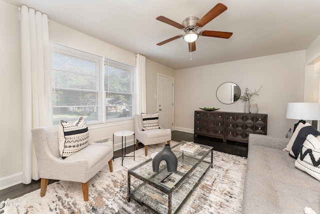 living room with ceiling fan and hardwood / wood-style flooring