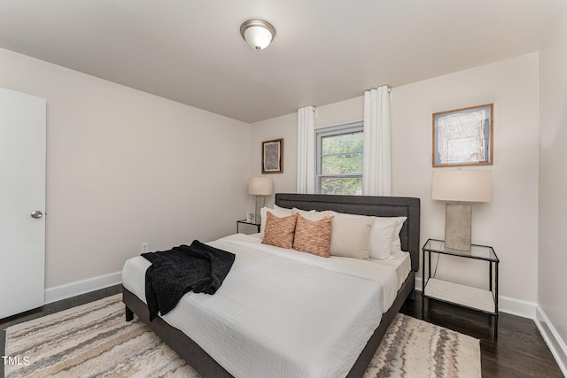 bedroom featuring dark hardwood / wood-style flooring