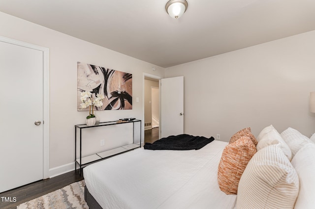 bedroom featuring dark hardwood / wood-style flooring