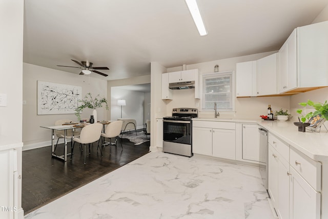 kitchen featuring white cabinets, stainless steel appliances, ceiling fan, and light hardwood / wood-style floors