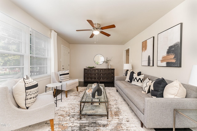 living room with ceiling fan and hardwood / wood-style flooring