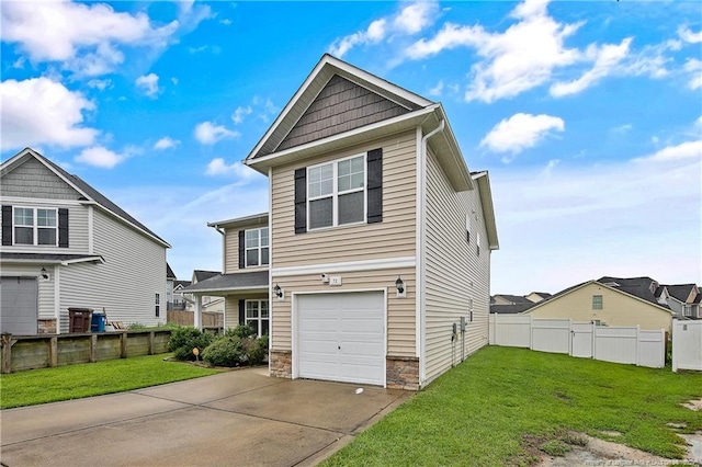 view of front facade with a garage and a front yard