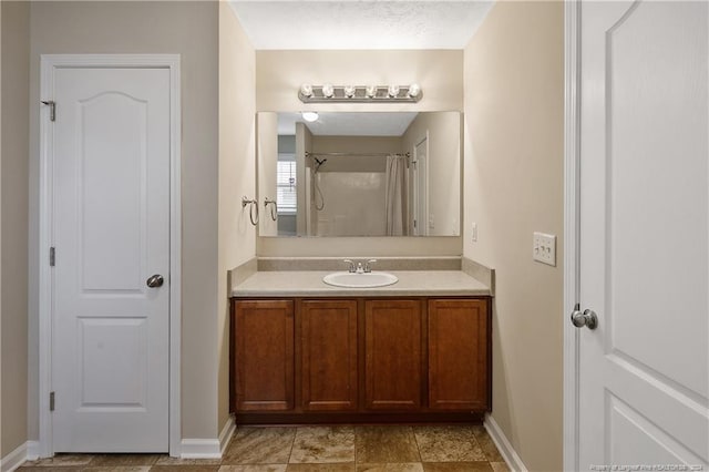 bathroom with vanity and a shower with shower curtain