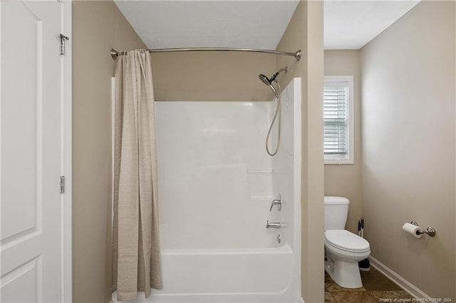 bathroom with shower / tub combo, tile patterned floors, and toilet