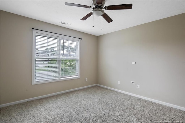 carpeted empty room with ceiling fan