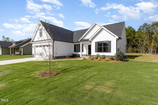 view of front of property featuring a garage and a front lawn