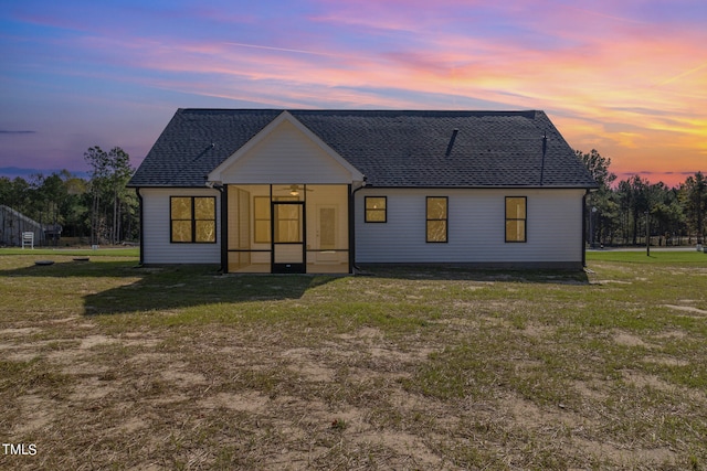 modern inspired farmhouse with a yard