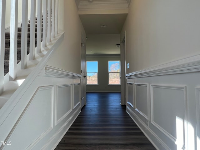 stairway featuring hardwood / wood-style flooring and ornamental molding