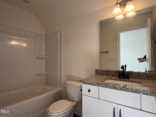 full bathroom with bathtub / shower combination, lofted ceiling, vanity, and toilet