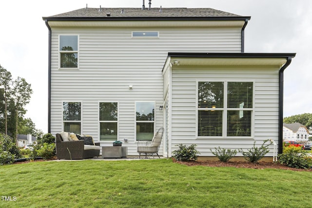 rear view of property with an outdoor living space, a patio, and a yard