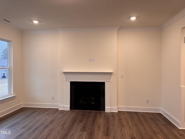 unfurnished living room featuring crown molding and dark hardwood / wood-style floors