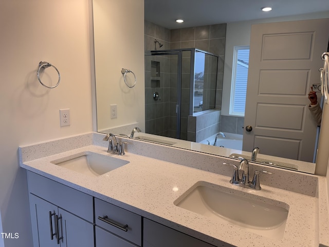 bathroom featuring vanity and plus walk in shower