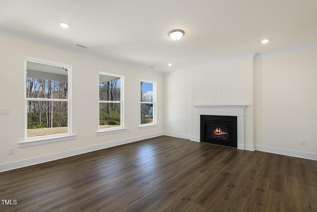 82 Gander Dr, Benson, NC 27504 - unfurnished living room featuring dark wood-style floors, visible vents, baseboards, recessed lighting, and a lit fireplace