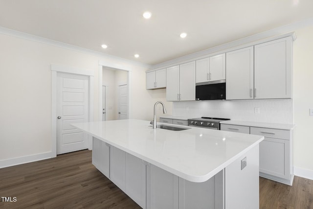 82 Gander Dr, Benson, NC 27504 - kitchen featuring a sink, crown molding, dark wood-type flooring, stainless steel range with electric stovetop, and a kitchen island with sink