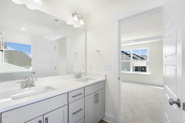 82 Gander Dr, Benson, NC 27504 - bathroom with a sink, visible vents, baseboards, and double vanity