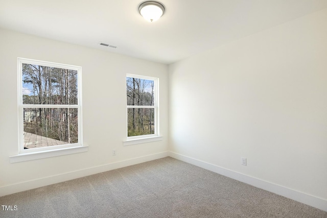 82 Gander Dr, Benson, NC 27504 - spare room featuring visible vents, baseboards, and carpet