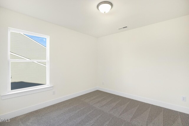 82 Gander Dr, Benson, NC 27504 - spare room featuring carpet, visible vents, and baseboards