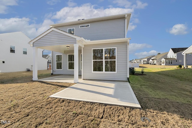 82 Gander Dr, Benson, NC 27504 - back of house with a patio and a lawn
